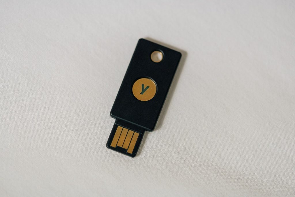 A person unlocking a smartphone with a fingerprint for secure sign-in.